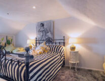 a bedroom with a zebra in a room