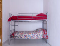 bed, wall, indoor, floor, chair, pillow, design, shelf, room, nightstand, bed frame, infant bed, couch, red, bed sheet