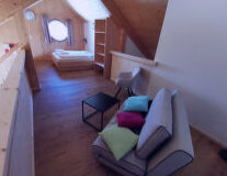 a living room with a wooden floor a living room with a wooden floor