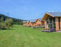 a house with a green field a house with a green field