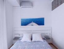 a bedroom with a blue background