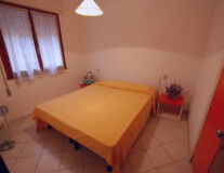 a bedroom with a tiled floor