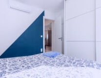 a bedroom with a bed in a room