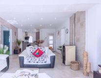 a living room filled with furniture and a table