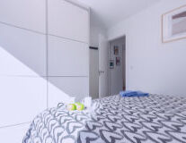 a bedroom with a bed in a room