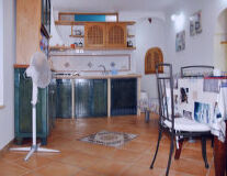 a kitchen with a wood floor