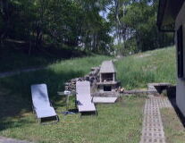a couple of lawn chairs sitting on top of a picnic table