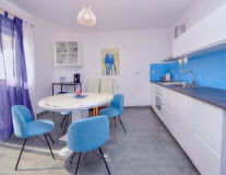 a kitchen with a blue chair