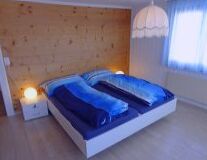 a bed with a wooden floor