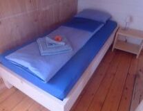 floor, bed, indoor, furniture, wall, pillow, couch, studio couch, wooden