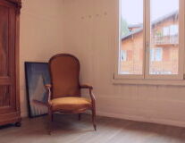 a chair sitting in front of a window