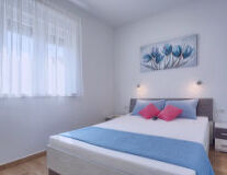 a bedroom with a blue background