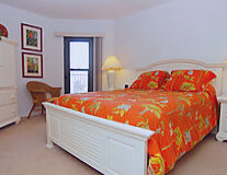 a bedroom with a bed in a room