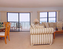 a living room filled with furniture and a large window