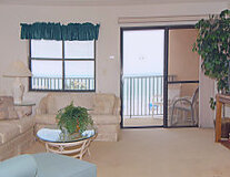 a living room filled with furniture and a window