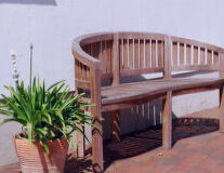 a wooden bench in a garden