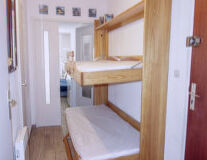indoor, furniture, bed, wall, floor, cabinetry, drawer, chest of drawers, house, table, curtain