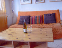 a living room with a wooden table