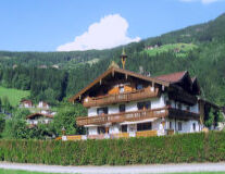 a house with Black Forest in the background