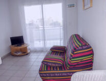 wall, indoor, floor, couch, bed, chair, table, vase, pillow, curtain, window