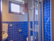 a blue tiled shower