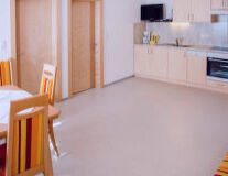 a kitchen with a wooden floor