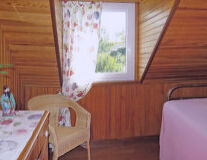a bedroom with a bed and a wooden table