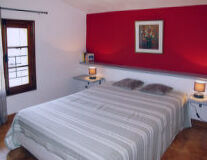 a bedroom with a large bed in a room