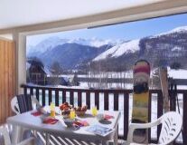 a dining room table in front of a mountain