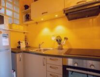 cabinet, indoor, sink, wall, yellow, countertop, cabinetry, home appliance, drawer, bathroom, tap, plumbing fixture