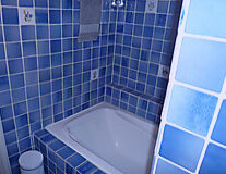 a blue tiled wall