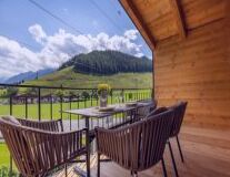 furniture, table, chair, bench, sky, plant, kitchen & dining room table, mountain, porch