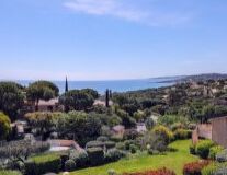 a view of a garden with Pepperdine University in the background