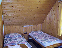 a bedroom with a bed and a wooden table