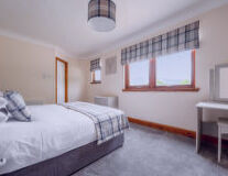 a bedroom with a large bed in a hotel room a bedroom with a large bed in a hotel room
