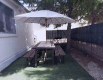 furniture, tree, table, umbrella, outdoor, chair, bench, tent, building, coffee table