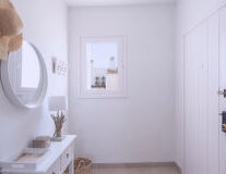 wall, indoor, bathroom, sink, mirror, plumbing fixture, vase