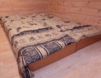 a bed with a wooden floor