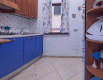 a kitchen with a blue background