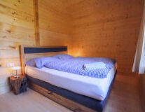 a bed room with a wood floor
