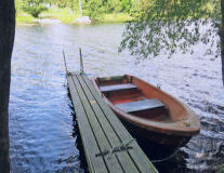 a wooden boat in a body of water