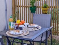 a dining room table in front of a fence