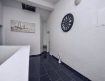 a clock in the middle of a room