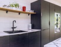 sink, indoor, bathroom, wall, countertop, cabinetry, home appliance, furniture, plumbing fixture, kitchen appliance, shelf, interior