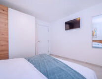 a bedroom with a bed in a room
