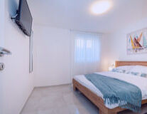 a bedroom with a bed in a room