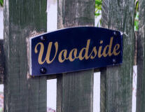 a close up of a street sign in front of a building