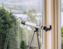 a tripod sitting in front of a window